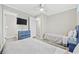 Comfortable bedroom features twin beds, a TV, soft colors, and an adjoining bath, perfect for relaxation at 900 N Waccamaw Dr. # 303, Murrells Inlet, SC 29576