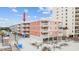 Beachfront condo complex with multiple units, white balconies, and a convenient ground-level parking area at 900 N Waccamaw Dr. # 303, Murrells Inlet, SC 29576