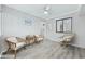 Bright sitting room with three chairs, a center table, wall decorations, and soft lighting for a cozy ambiance at 900 N Waccamaw Dr. # 303, Murrells Inlet, SC 29576
