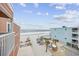 Enjoy the stunning beach view from this condo, complete with palm trees and a private pool at 900 N Waccamaw Dr. # 303, Murrells Inlet, SC 29576