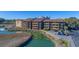 Aerial view of the condo building with river view, showcasing its lovely surrounding landscape at 9501 Shore Dr. # A-314, Myrtle Beach, SC 29572