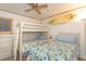 Charming bedroom with a bunk bed and a twin bed, decorated with a surfboard at 9501 Shore Dr. # A-314, Myrtle Beach, SC 29572