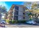 Exterior view of the condo building, featuring private screened balconies, neat landscaping and ample parking at 9501 Shore Dr. # A-314, Myrtle Beach, SC 29572