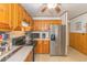 A kitchen with stainless steel appliances and wooden cabinets at 9501 Shore Dr. # A-314, Myrtle Beach, SC 29572