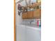 Well organized laundry room with shelving, storage cabinets, and a modern washer and dryer set at 9501 Shore Dr. # A-314, Myrtle Beach, SC 29572