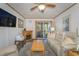 Comfortable living room with a fireplace, ceiling fan, and access to a private balcony at 9501 Shore Dr. # A-314, Myrtle Beach, SC 29572