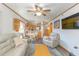 Open-concept living room with a ceiling fan and seamlessly connected to the kitchen at 9501 Shore Dr. # A-314, Myrtle Beach, SC 29572