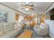 Open-concept living room with a ceiling fan and seamlessly connected to the kitchen at 9501 Shore Dr. # A-314, Myrtle Beach, SC 29572
