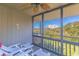 A screened patio with lounge chairs and views of a building in the distance at 9501 Shore Dr. # A-314, Myrtle Beach, SC 29572