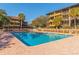 Community pool with sparkling blue water, surrounded by lounge chairs and well-maintained condo buildings at 9501 Shore Dr. # A-314, Myrtle Beach, SC 29572