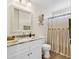 Bathroom with decorative mirror, spacious vanity, and shower featuring a curtain and accents at 982 Bonita Loop, Myrtle Beach, SC 29588