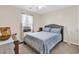 Cozy bedroom features a comfortable bed with patterned bedding, natural light, and neutral decor at 982 Bonita Loop, Myrtle Beach, SC 29588