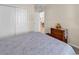 Comfortable bedroom with closet and wooden dresser, offering a serene and inviting space at 982 Bonita Loop, Myrtle Beach, SC 29588