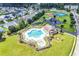 Aerial view of the community pool with a clubhouse, pool and playground at 982 Bonita Loop, Myrtle Beach, SC 29588