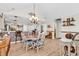 Open-concept dining area featuring wood floors and a brick-accented breakfast bar at 982 Bonita Loop, Myrtle Beach, SC 29588