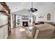 Spacious living room with a vaulted ceiling, fireplace, and large windows with views of water at 982 Bonita Loop, Myrtle Beach, SC 29588