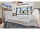 Main bedroom with a tray ceiling, fan, and a large window with great natural light at 982 Bonita Loop, Myrtle Beach, SC 29588