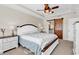 Main bedroom with a tray ceiling, ceiling fan, and a barn-style sliding door at 982 Bonita Loop, Myrtle Beach, SC 29588