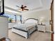 Main bedroom featuring a tray ceiling, fan, and large window at 982 Bonita Loop, Myrtle Beach, SC 29588