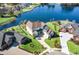 Aerial view of a beautiful light blue home with a large backyard overlooking a serene lake at 1042 Muscovy Pl., Conway, SC 29526