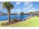 Lush backyard with tropical landscaping, a boat lift, and pond views at 1042 Muscovy Pl., Conway, SC 29526