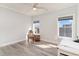 A bedroom with a ceiling fan and natural light through the windows, accompanied by a desk at 1042 Muscovy Pl., Conway, SC 29526