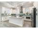 This spacious kitchen features stainless steel appliances, white cabinets, granite countertops, and a bright backsplash at 1042 Muscovy Pl., Conway, SC 29526