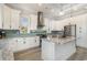 Modern kitchen featuring white cabinets, granite countertops, stainless steel appliances, and a center island at 1042 Muscovy Pl., Conway, SC 29526