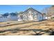 Backyard showcasing house exterior, white fencing and screened porch at 105 Wagon Wheel Ln., Surfside Beach, SC 29575