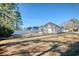 Open backyard showing the house's exterior and fenced property line at 105 Wagon Wheel Ln., Surfside Beach, SC 29575