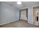 Bedroom featuring neutral carpet, a ceiling fan, and an ensuite bathroom at 105 Wagon Wheel Ln., Surfside Beach, SC 29575