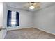 Bedroom featuring neutral carpet, ceiling fan, and window with blinds at 105 Wagon Wheel Ln., Surfside Beach, SC 29575