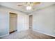 Bedroom with carpet, ceiling fan, and closet with white doors and shelving at 105 Wagon Wheel Ln., Surfside Beach, SC 29575