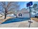 Inviting home exterior featuring a driveway with a basketball hoop and a well-maintained lawn at 105 Wagon Wheel Ln., Surfside Beach, SC 29575