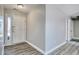 Bright foyer featuring modern wood flooring and a white door, providing a welcoming entrance at 105 Wagon Wheel Ln., Surfside Beach, SC 29575