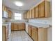 Functional kitchen with oak cabinets, laminate countertops, and tile flooring at 105 Wagon Wheel Ln., Surfside Beach, SC 29575