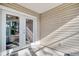 Covered patio area with glass doors leading to backyard at 105 Wagon Wheel Ln., Surfside Beach, SC 29575