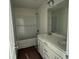 Bathroom with double vanity, shower/tub, and subway tile surround at 1064 Jase Dr., Longs, SC 29568