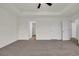 A bedroom with neutral tones, carpet, and doors leading to a closet and other areas of the home at 1064 Jase Dr., Longs, SC 29568