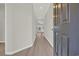 Inviting hallway with wood-look floors leads to bright living spaces at 1064 Jase Dr., Longs, SC 29568