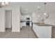 Bright, open kitchen with island, granite counters, and stainless steel appliances at 1064 Jase Dr., Longs, SC 29568