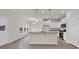 Open-concept kitchen with island, pendant lighting, and modern appliances at 1064 Jase Dr., Longs, SC 29568