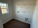 Laundry room with washer/dryer hookups, overhead shelving and one window for ample natural light at 1064 Jase Dr., Longs, SC 29568