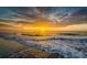 Beautiful sunset over the ocean with golden light reflecting on the water and sandy beach at 1064 Jase Dr., Longs, SC 29568