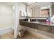 This bathroom features a large granite vanity and a tub and shower combination for relaxation at 1105 S Ocean Blvd. # 604, Myrtle Beach, SC 29577