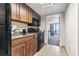 This cozy kitchen features updated appliances, granite countertops, and a view into the dining area and balcony at 1105 S Ocean Blvd. # 604, Myrtle Beach, SC 29577