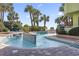 Outdoor pool area with a unique design features palm trees and seating, creating a resort-like experience for residents at 1105 S Ocean Blvd. # 604, Myrtle Beach, SC 29577