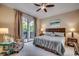 Inviting bedroom featuring a comfortable bed, patterned chair and sliding door to the outdoor living space at 123 Avian Dr. # 102, Pawleys Island, SC 29585