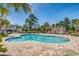 Inviting community pool with a shaded pergola and ample lounge chairs at 123 Avian Dr. # 102, Pawleys Island, SC 29585