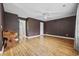 Spacious bedroom with wood-look flooring, a ceiling fan and neutral wall paint at 125 Ole Cedar Ln., Conway, SC 29526